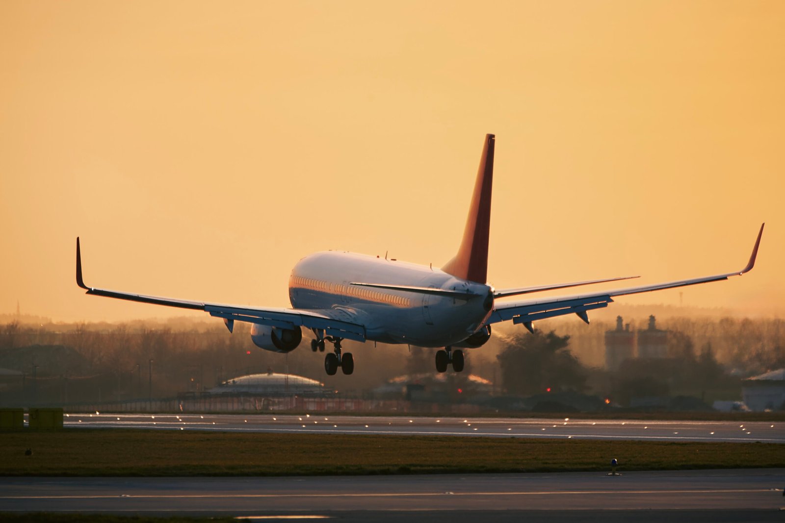 airplane approaching for landing on airport runway- About Caelum